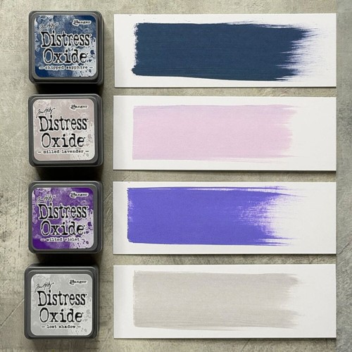 Cztery kolory tuszu Distress Mini Oxide z zestawu Kit 17: Chipped Sapphire, Milled Lavender, Wilted Violet i Lost Shadow ułożone razem